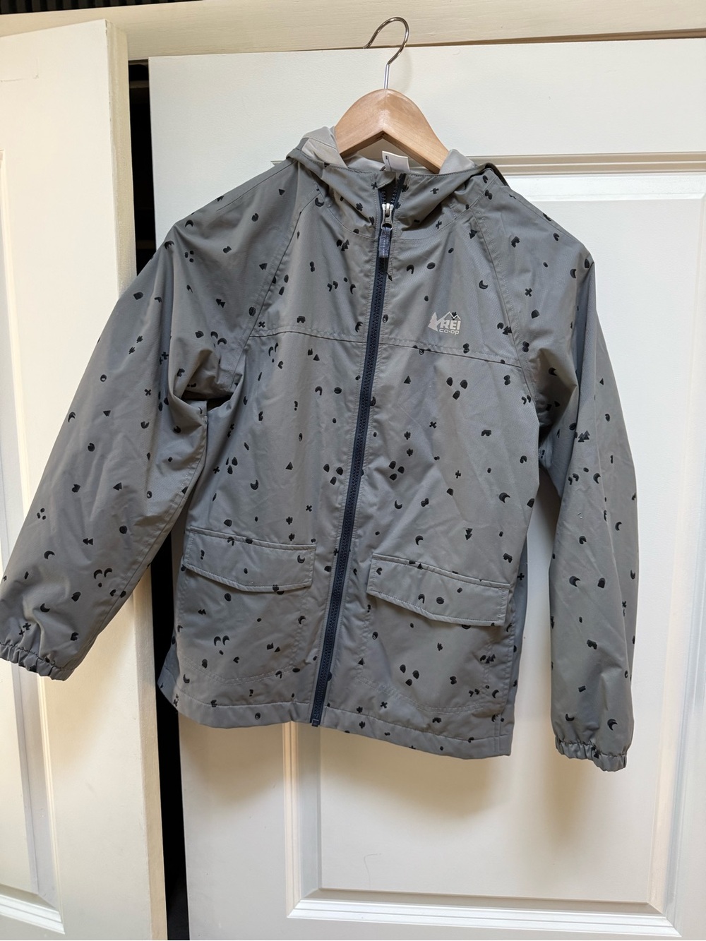 REI Kids' Light Gray Hooded Rain Jacket with Black Dot Print